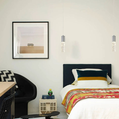 Bedroom scene with Three Light Kitchen Island Pendant With Dimmable LED 3000K Warm Glow, above a modern bed and colorful blanket.