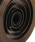 Close-up of a rolled Copper Main Watch Spring Replacement Part for Do It Yourself Pros and Watchmakers, 1.93-inch clock spring.