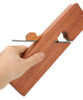 Premium Professional Grade Single Pull Hand Planer held in hand, showcasing wood and steel construction, designed for efficient edge trimming.