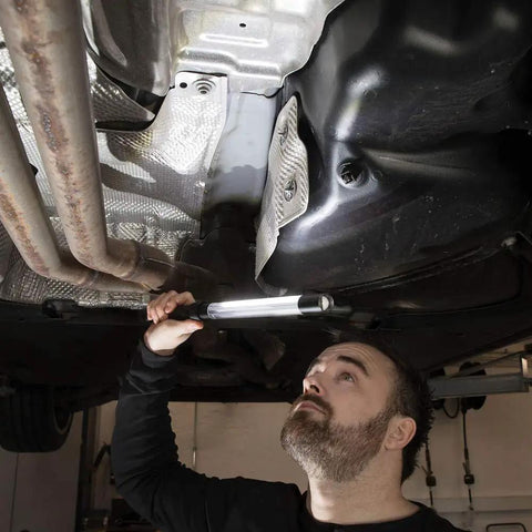 Person using Rechargeable Inspection LED Work Light With Top Spotlight 600 Lumen Removable Cord under vehicle