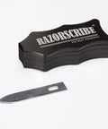Precision Adjustable Carpentry Scribe Tool With Integrated Stud Detector Featuring Dead On Marking Blade For Ninety Degree Corners and Cramped Spaces Packing Eight Quick Offsets for Top Shelf Layout Work Every Tradesman Gotta Have, displaying the tool and blade.