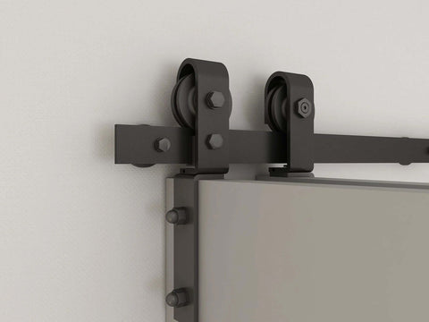 Sliding hardware kit for Unfinished 30 Inch By 84 Inch Wood Bi Fold Barn Door DIY Install, showing rollers and track on a wall.