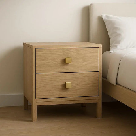 Solid Brass Square Cabinet Knobs In Brushed Gold Finish on wooden nightstand with two drawers next to bed