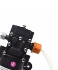 12V Vacuum Pump Siphon And Fluid Transfer Pump For Cars Boats Motorbikes Diesel Electric With Hose Black Workhorse For Fast Fluid Transfer 5L Per Minute 0.8MPa Max 60W Portable, black pump close-up with hose and orange fitting