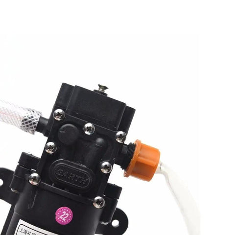 12V Vacuum Pump Siphon And Fluid Transfer Pump For Cars Boats Motorbikes Diesel Electric With Hose Black Workhorse For Fast Fluid Transfer 5L Per Minute 0.8MPa Max 60W Portable, black pump close-up with hose and orange fitting