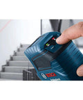 Person using Beefy Outdoor Green Cross Line Laser Level With 75 Ft Range near staircase, electronic laser control visible.