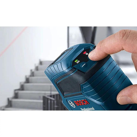Person using Beefy Outdoor Green Cross Line Laser Level With 75 Ft Range near staircase, electronic laser control visible.