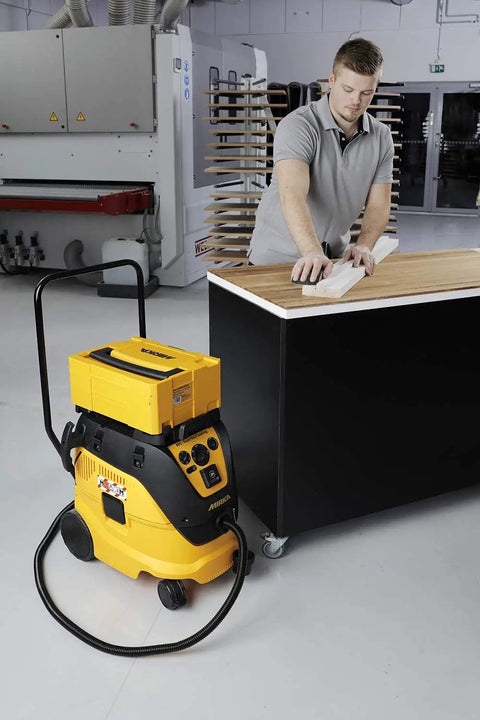 Man sanding wood with Dust Free Roundy Hand Sanding Block Kit With 6 Inch Sandpaper Discs Hook And Loop Abranet Mesh Discs.