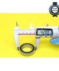 6905 Hybrid Ceramic Bearing 25X42X9MM ABEC-1 Si3N4 Steel Rings being measured with a caliper at 42mm on a yellow background.