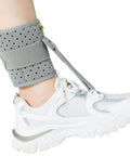 Drop Foot Ankle Brace Orthosis with cushioned comfort in gray, providing adjustable wrap compression for easier walking and improved gait.