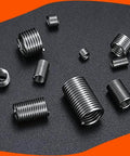 Stainless steel inserts for Robust 200 Piece Thread Repair Kit With Stainless Steel Inserts For Damaged Threads M3 To M8 on black background