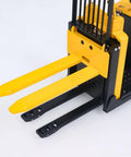 Get Your Hands On This Wheelfun RTR Metal 1/14 Electric Remote Control Forklift MO55 close-up of yellow lifting forks and base.