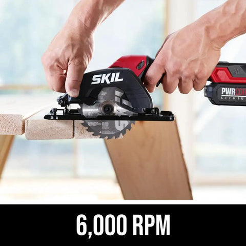 Super Compact One Handed Cordless Circular Saw Kit With Four And A Half Inch Blade Brushless Motor 20V Lithium Battery And Charger cutting wood at 6000 RPM.
