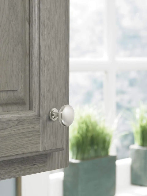 Top Notch Ten Pack Of 1.25 Inch Round Cabinet Knobs With Slick Satin Nickel Coating For Kitchen Drawers on cabinet door.