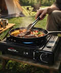 Person cooking on 8,000 BTU Portable Gas Stove With Carrying Case For Camping, Picnics, Hiking, Fishing And BBQ, CSA Listed