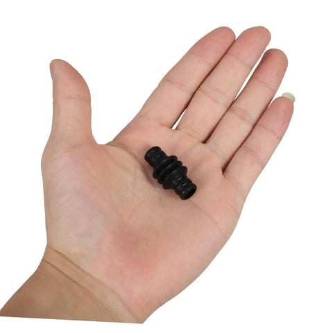Hand holding a Heatproof Rubber Steam Wand Cover For Espresso Machine Pro Grade Insulation Sleeve in black color