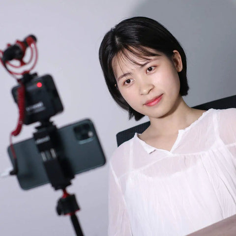 Person using VL49 2000mAh LED Video Light With 3 Cold Shoe Mounts Beast Bright Soft Light Panel for vlogging