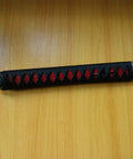 Dope DIY Tsuka Sword Handle Kit Ten Point Two Inch for Samurai Katana with black and red Ito wrap on wooden table