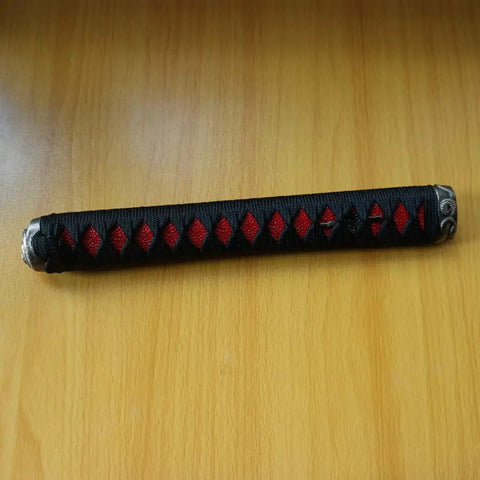 Dope DIY Tsuka Sword Handle Kit Ten Point Two Inch for Samurai Katana with black and red Ito wrap on wooden table
