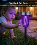 Child reaching for Solar Powered Outdoor Bug Zapper Pack of 4 for Backyard, Garden and Walkways, 360 Degree Mosquito Barrier.