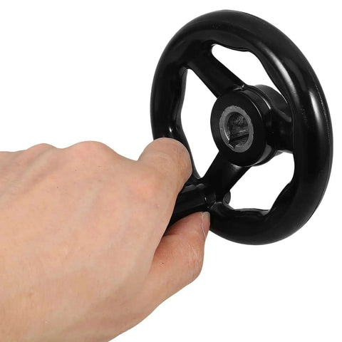Hand holding 2 Piece Black Hand Wheel Knobs For Milling Machines With Smooth Rotation And Dimensional Stability, Bakelite and Iron
