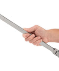 Hand holding 22 mm Long Fixed And Flex Head 12 Point Ratcheting Box End Wrench With Dual Head Design For Tight Spaces in studio