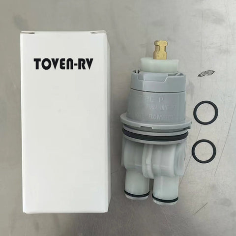 Front view of RP46074 Delta shower valve cartridge: gray plastic body, brass stem, two black O-rings, TOVEN-RV box.