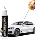 Hand using 2 In 1 Touch Up Paint Pen For Cars Quick Dry Auto Scratch Remover Precision Metal Tip With Built In Brush Color Accurate White 0.4 Fl Oz Easy Fix For Scratches Chips Dents And Surface Blems near a white sedan.