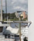 Close-up of Stainless Steel 3 16th Inch Cable Railing Kit with lag screws on outdoor deck rail system.