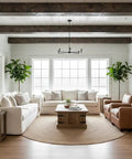 Bright living room featuring white sofas, wooden table, and greenery, showcasing Top Shelf Water Based Reactive Wood Stain Delivers A Real Deal Aged Barrel Finish Perfect For Vintage Furniture Restoration With Quick Dry Performance And Low Odor.