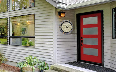 Inca II 18 Inch Outdoor Clock Thermometer Weather Station Combo with faux stone mosaic frame installed beside a red door