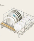 Fully Automatic Countertop Dishwasher With Ultrasonic Scrubbing And Auto Dry, metal drying rack holding clean plates and bowls.