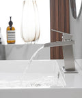 Matte Black Bathroom Faucet With Waterfall Spout Sleek Dope Pop Up Drain Stopper Overflow Assembly Supply Hose Single Hole Handle Modern Lavatory Mixer Tap For Sink with water flowing into sink