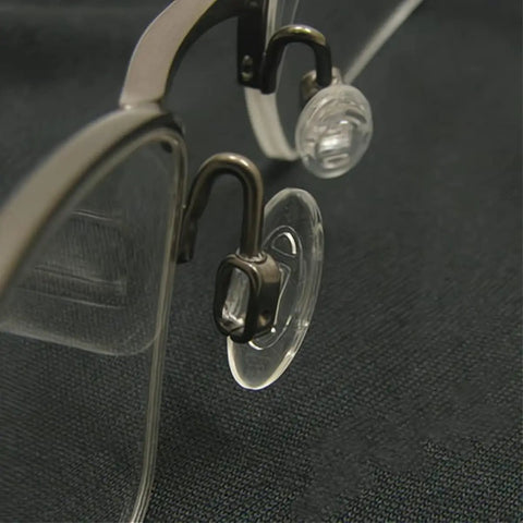 Close up of Slide Right In Nose Pads 5 Pairs Ultra Smooth Silicone Glasses Replacement Anti Slip Oval Eyewear Cushions on specs.