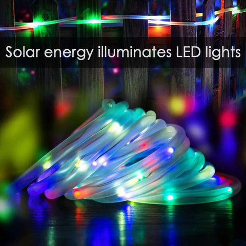 Solar Rope Lights 40 Ft 120 LEDs Multi Color Fairy Lights With 8 Modes glowing in a coil, ideal for outdoor garden decor