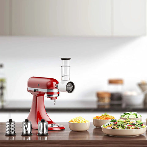 Pro-Grade Meat Grinder And Slicer Shredder Attachments For Stand Mixers, shown on red mixer with vegetables and slicer drums