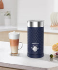 4 In 1 Electric Milk Frother And Warmer For Lattes Cappuccinos Macchiatos Hot Chocolate And Matcha with glass of frothed coffee on counter