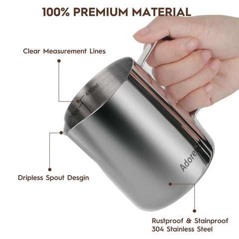 Hand holding Milk Frothing Pitcher 16oz 480ml Stainless Steel Steaming Cup with Latte Art Pen, showing measurement lines and spout.