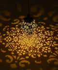 2 Pack Hanging Solar Lights With Moroccan Olive Pattern Lanterns illuminating intricate shadow patterns on wall.