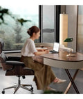 Top Shelf Ergonomic Standing Desk With Integrated Monitor Riser, Versatile Ash Wood Computer Table in home office setup.