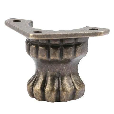 Close-up of an Antique Beast Feet Leg Corner Protector, bronze zinc alloy, for wooden boxes and small furniture with screws.