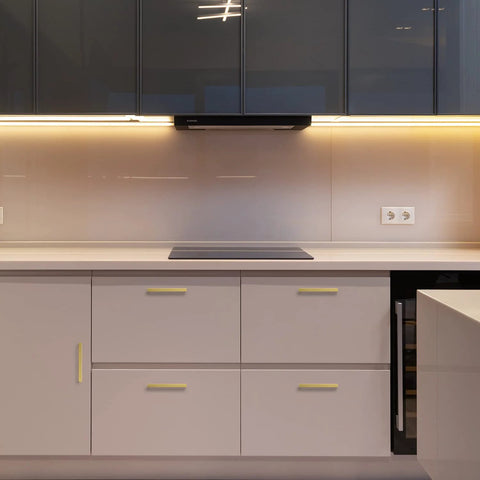 Modern kitchen with 30 Pack 5 Inch Square Cabinet Handles in Brushed Brass Finish Stainless Steel Kitchen Hardware Pulls visible on white cupboards.