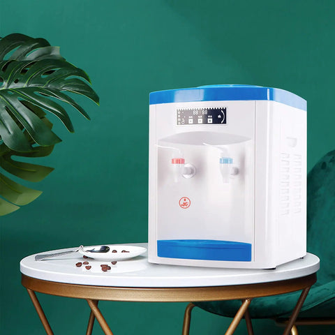 Hot And Cold Water Desktop Dispenser For 1.3 To 5 Gallon Jugs Top Loading Countertop Cooler on a table