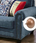 Hella Sturdy Gold Upholstery Tacks 100 Pack Set For Furniture Nailhead Decorative Trim on a blue sofa arm.