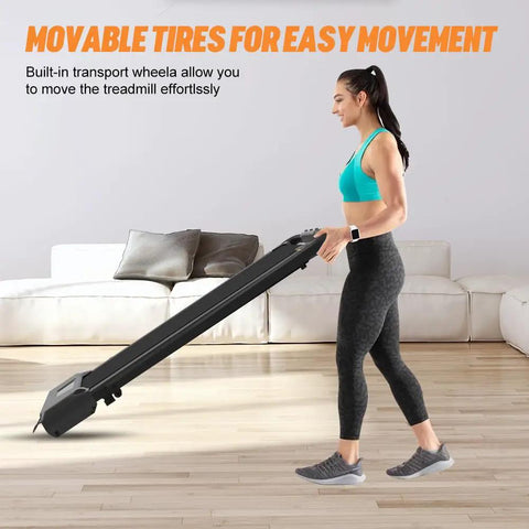 User demonstrating the movable tires of the Slick Foldable Treadmill With Bright Led Display And Handy Remote Control for easy transport.