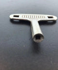 Replacement Clock Key N3 3mm For German 400 Day Miniature Clock DIY Repair Kit on black surface in close-up view