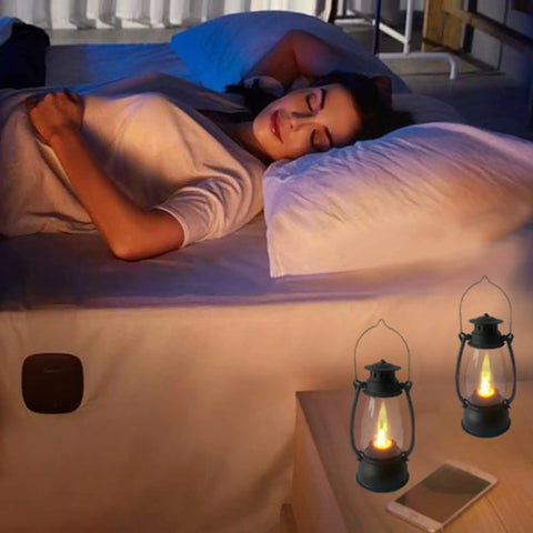 5.1 Inch Mini Lanterns Six Pack LED Candle Lanterns For Indoor Outdoor Decor illuminating a bedroom bedside, creating a warm ambiance