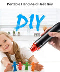 Mini Heat Gun For DIY Projects, Quick Embossing, Shrink Wrap, Paint Drying, And More held by a person near a child with crafts