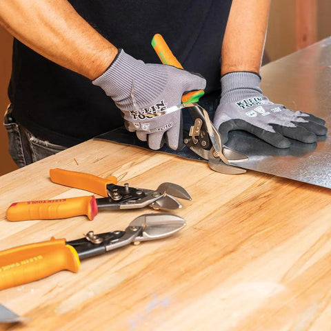 Klein Tools 2401R right-cutting offset tin snips cutting sheet metal; forged blade, orange handles
