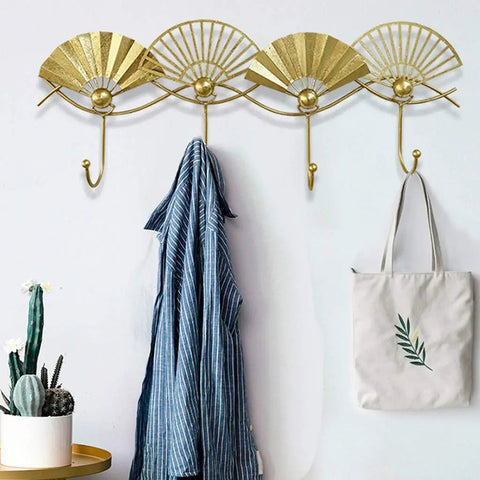 Top Shelf Golden Wall Mounted Coat Rack Featuring Tough Fan Shaped Hooks Rust Resistant Steel with blue jacket and bag.